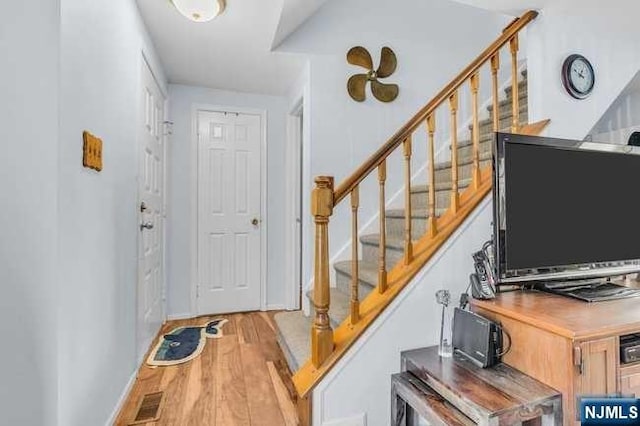 foyer with light hardwood / wood-style floors