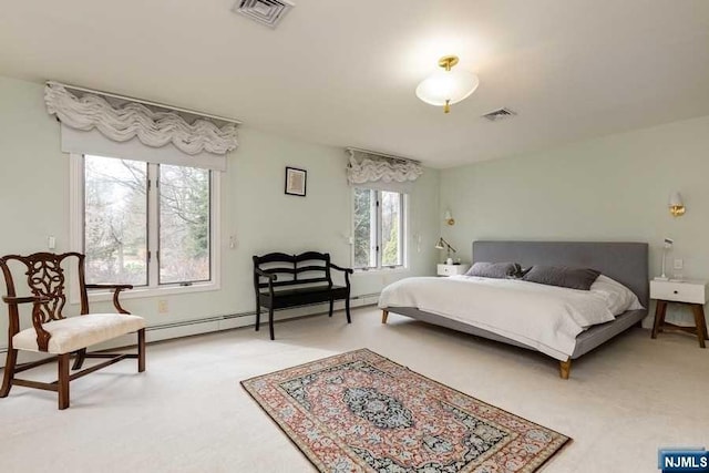 bedroom featuring carpet floors and a baseboard heating unit