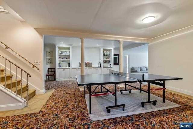 recreation room featuring light carpet