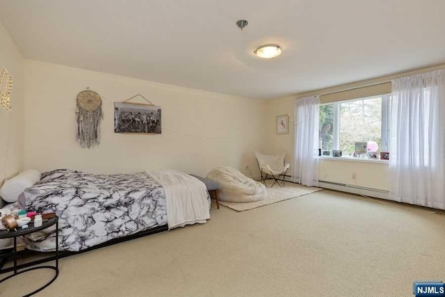 bedroom with carpet flooring and a baseboard radiator