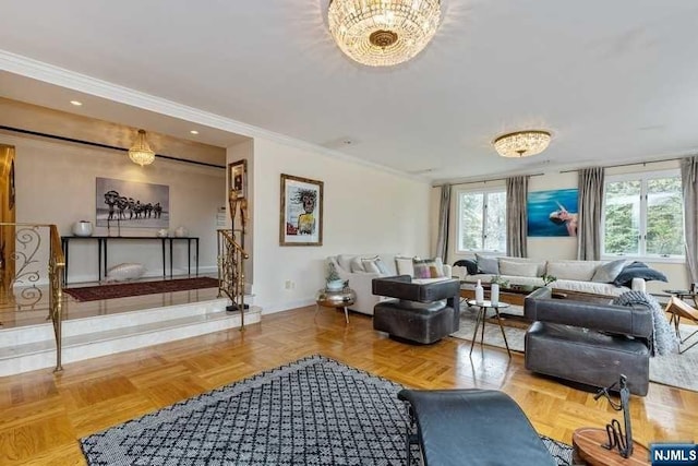 living room with an inviting chandelier, ornamental molding, and parquet flooring