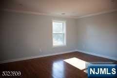 unfurnished room featuring dark hardwood / wood-style floors