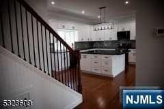 staircase featuring hardwood / wood-style flooring