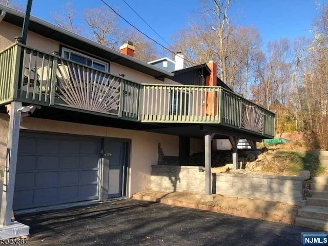 back of house with a garage