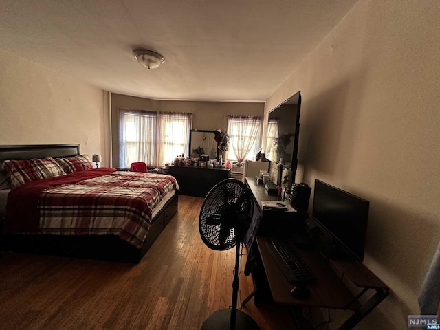 bedroom with hardwood / wood-style flooring