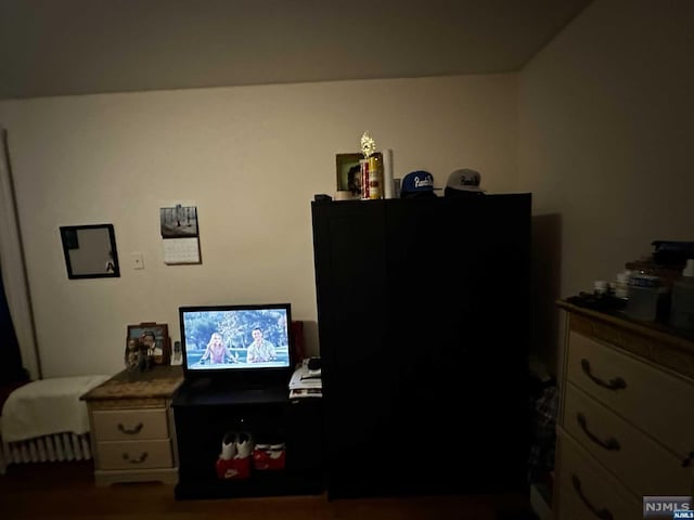 bedroom with hardwood / wood-style flooring