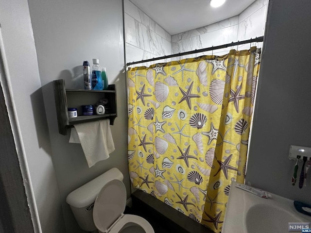 bathroom featuring toilet