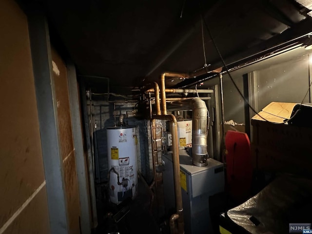 utility room with gas water heater