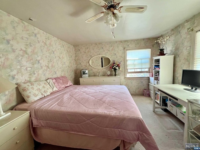 carpeted bedroom with ceiling fan