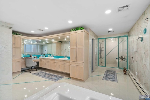 bathroom featuring baseboard heating, separate shower and tub, vanity, and tile walls