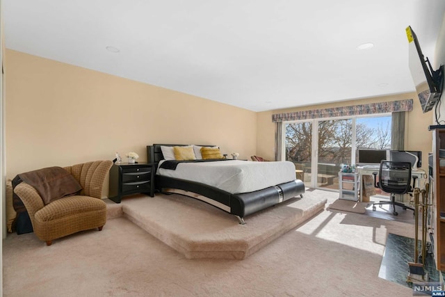 bedroom featuring carpet flooring and access to exterior