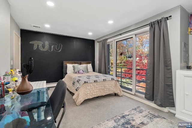 bedroom featuring carpet flooring and a baseboard heating unit