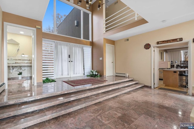 entryway featuring a baseboard heating unit