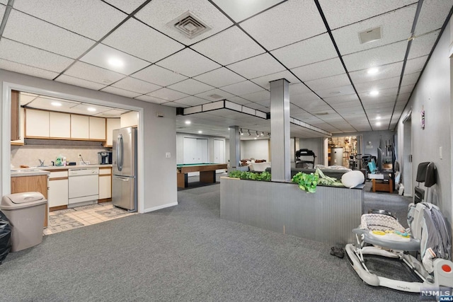 interior space with sink, stainless steel fridge, white dishwasher, light carpet, and pool table