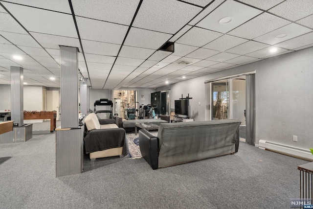 carpeted living room featuring baseboard heating and a paneled ceiling