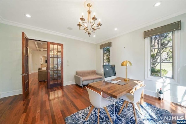 dining space with dark hardwood / wood-style floors, ornamental molding, a chandelier, and french doors