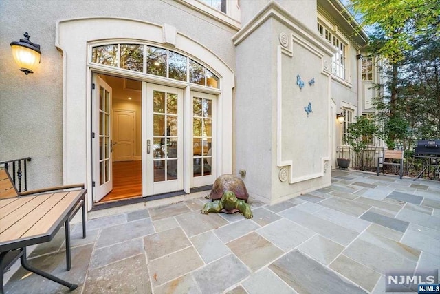 doorway to property featuring a patio