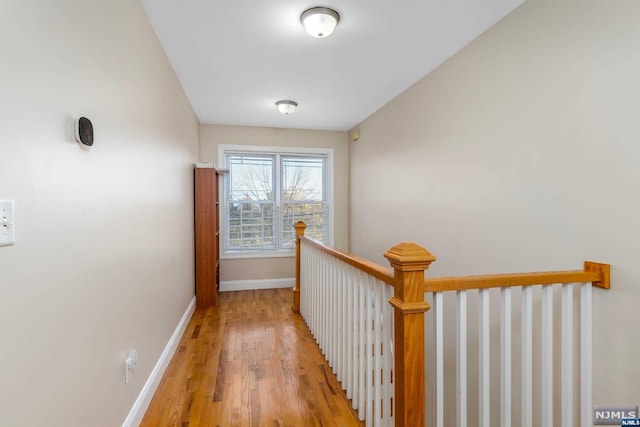 hall with light hardwood / wood-style floors