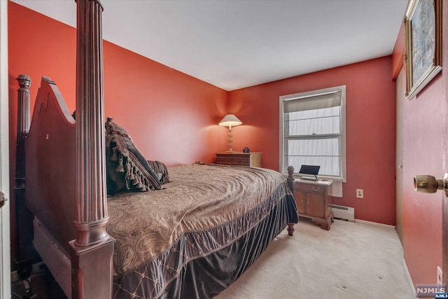 bedroom featuring baseboard heating and light colored carpet