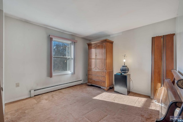 unfurnished bedroom featuring light colored carpet and a baseboard radiator