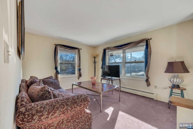 carpeted living room featuring a baseboard heating unit