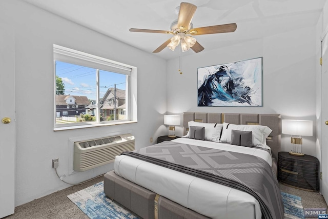 carpeted bedroom with a wall mounted AC and ceiling fan