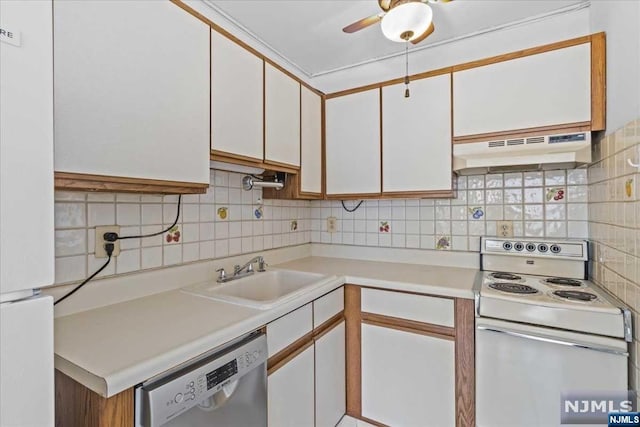 kitchen featuring white cabinets, white appliances, tasteful backsplash, and sink