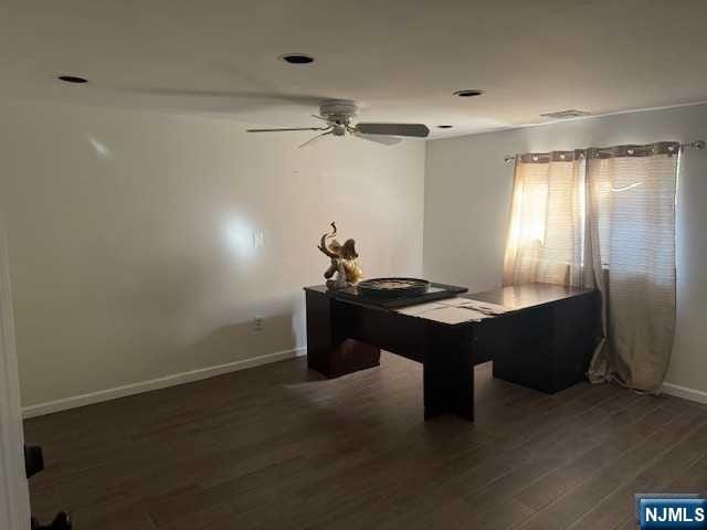 office featuring ceiling fan and dark hardwood / wood-style flooring