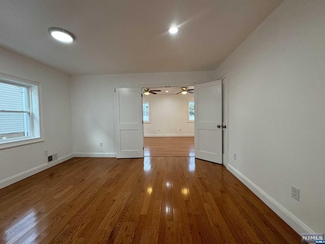 empty room featuring wood-type flooring