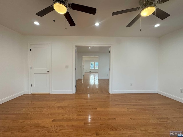 empty room featuring light hardwood / wood-style floors and ceiling fan