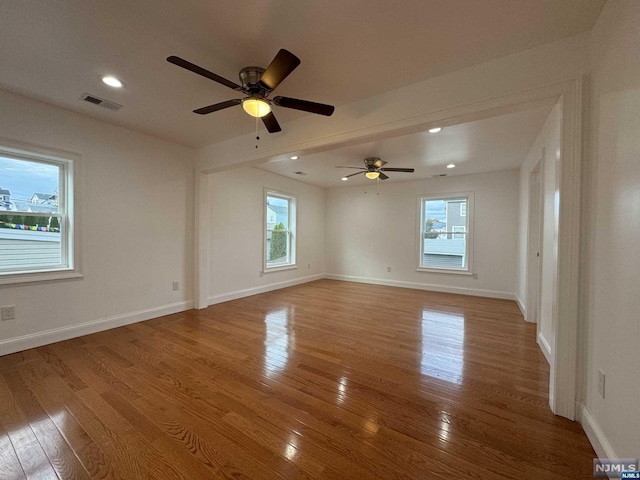 spare room with ceiling fan and hardwood / wood-style floors