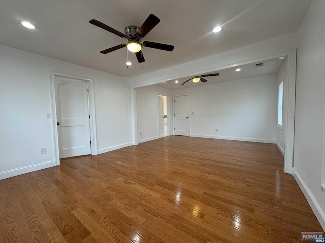 empty room featuring ceiling fan and wood-type flooring