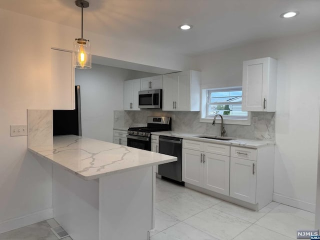 kitchen with white cabinets, sink, and black appliances