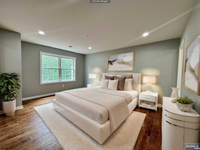 bedroom featuring dark wood-type flooring