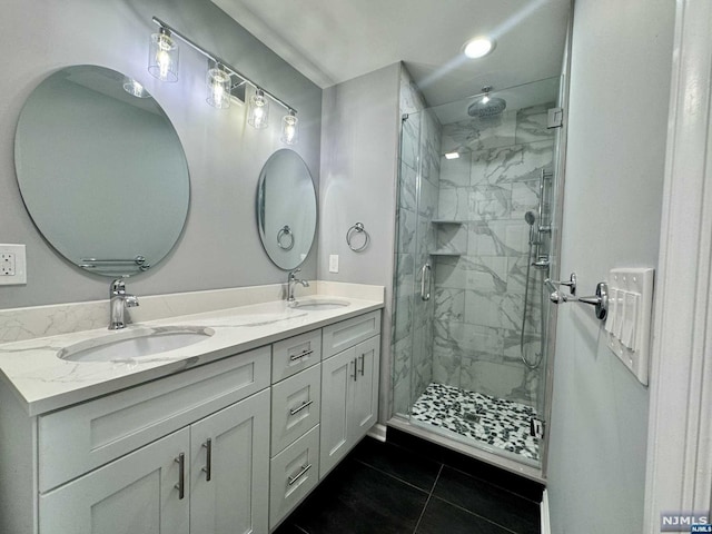 bathroom with vanity, tile patterned floors, and a shower with shower door