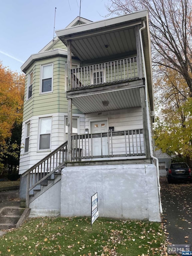 rear view of house with a balcony