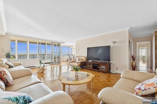 living room with parquet flooring, crown molding, and a healthy amount of sunlight