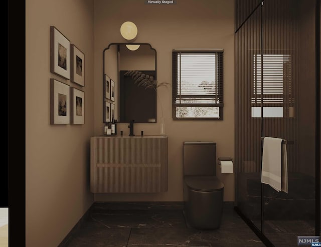 bathroom with vanity and toilet