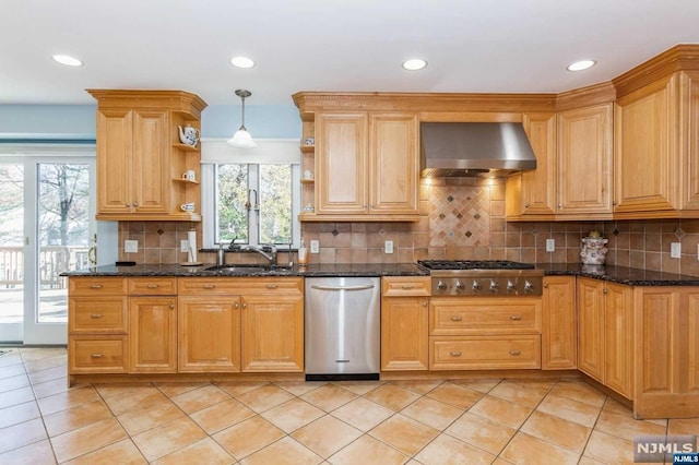 kitchen with open shelves, a sink, dark stone counters, appliances with stainless steel finishes, and wall chimney exhaust hood