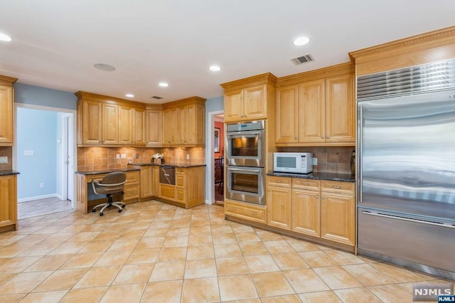 kitchen with light tile patterned floors, visible vents, appliances with stainless steel finishes, and decorative backsplash