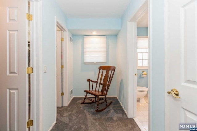 interior space with tile patterned flooring, visible vents, toilet, and baseboards