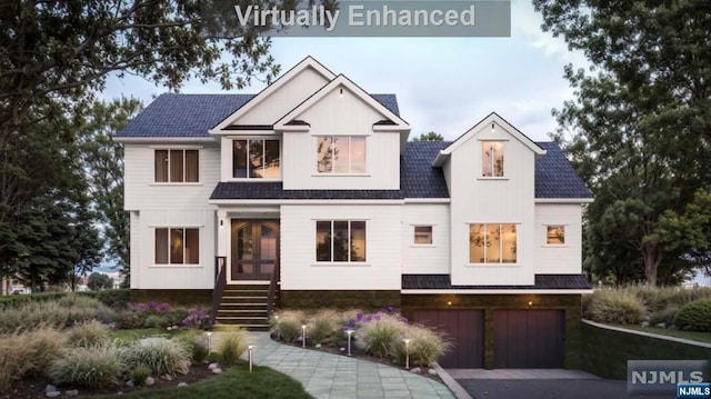 view of front facade featuring french doors and a garage