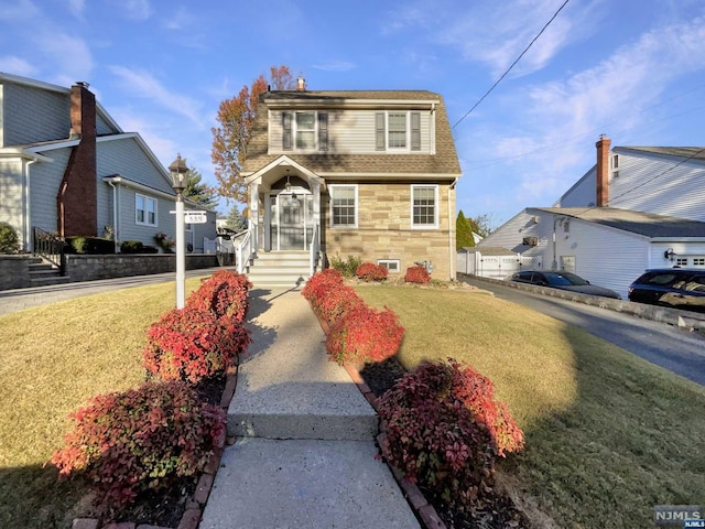 view of front of home with a front lawn