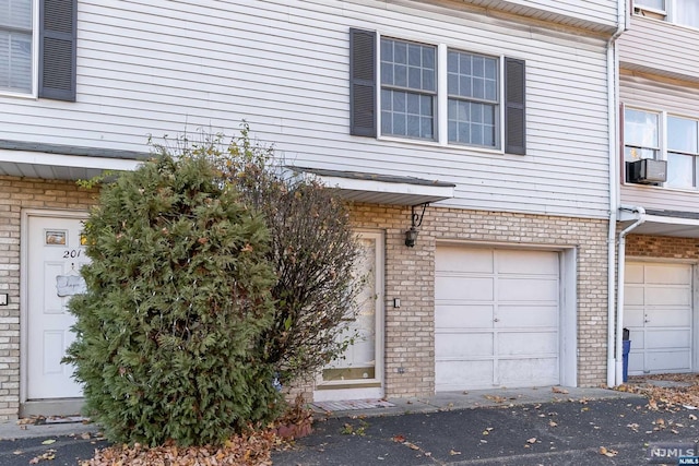 203 E Main St, Prospect Park, NJ 07508 - entrance to property with a garage and cooling unit