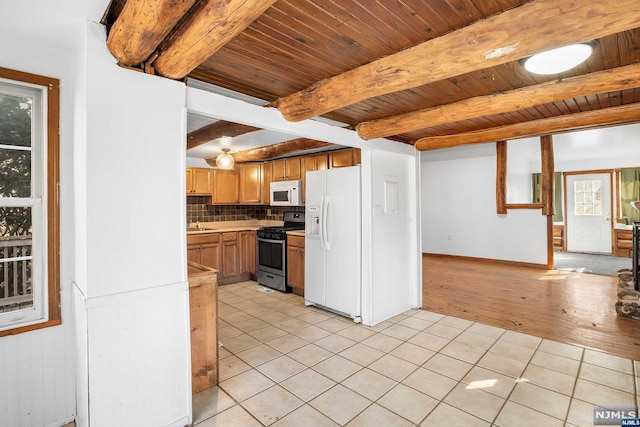 kitchen featuring light hardwood / wood-style flooring, beamed ceiling, white appliances, decorative backsplash, and wood ceiling