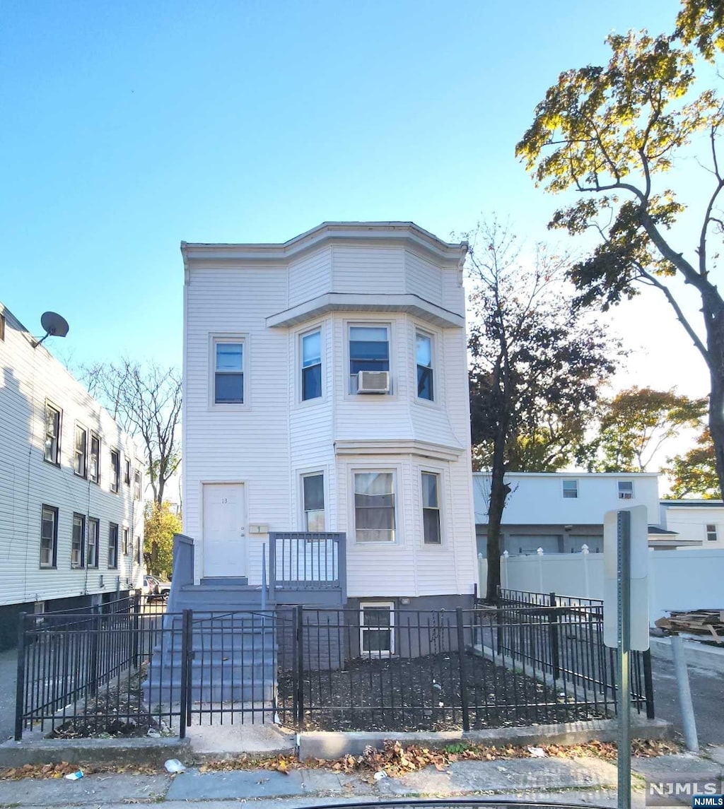 view of front of house with cooling unit