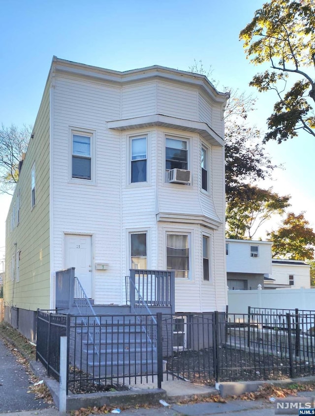 view of front of property with cooling unit