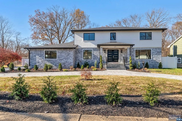 view of front of property with a front lawn