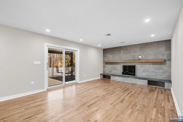 unfurnished living room featuring light hardwood / wood-style floors