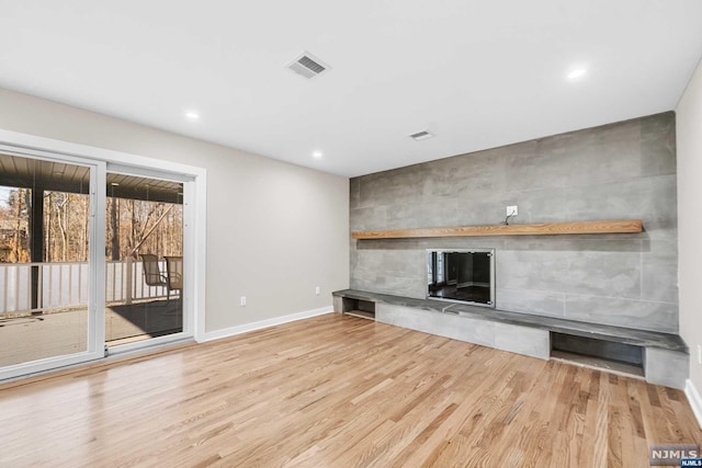 unfurnished living room featuring light hardwood / wood-style floors